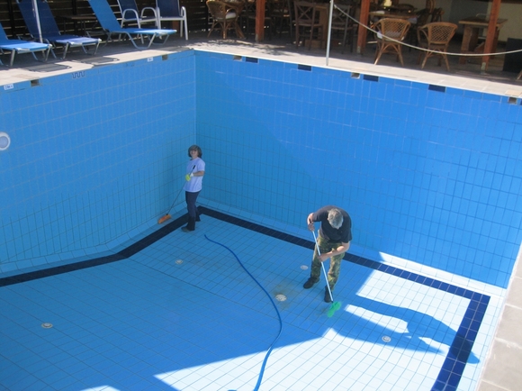 Kostas and Chrysa cleaning pool prior to 2013 opening..